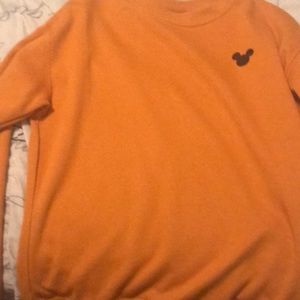 A dark orange sweater